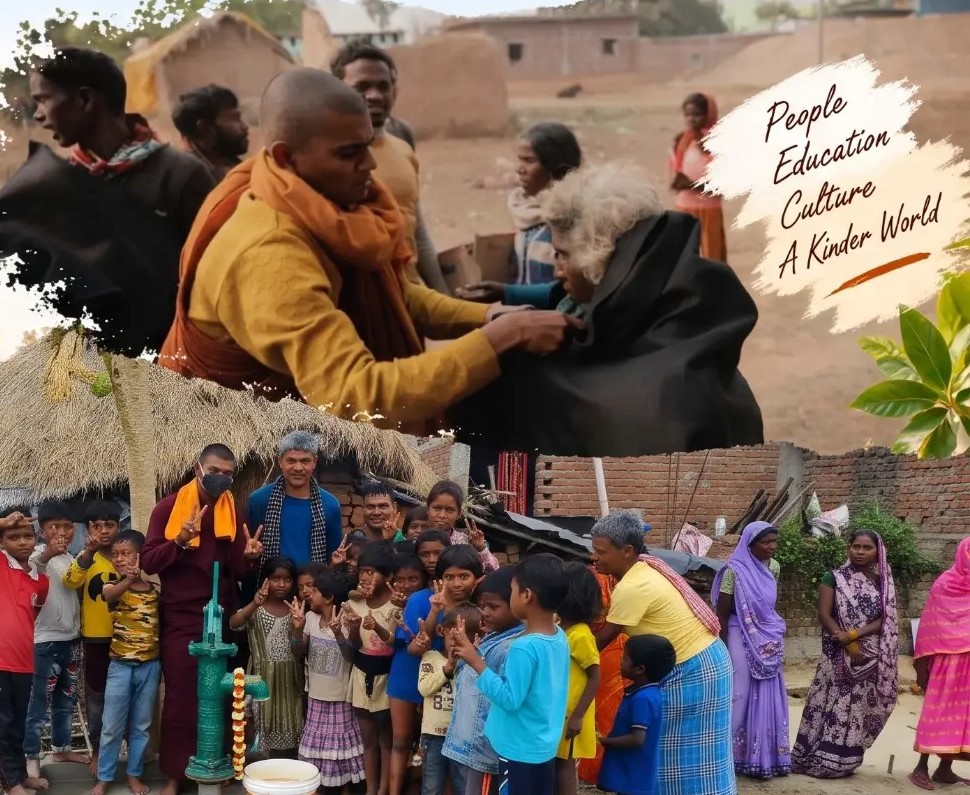 Dharam supporting elders and celebrating clean water with village families in Bihar